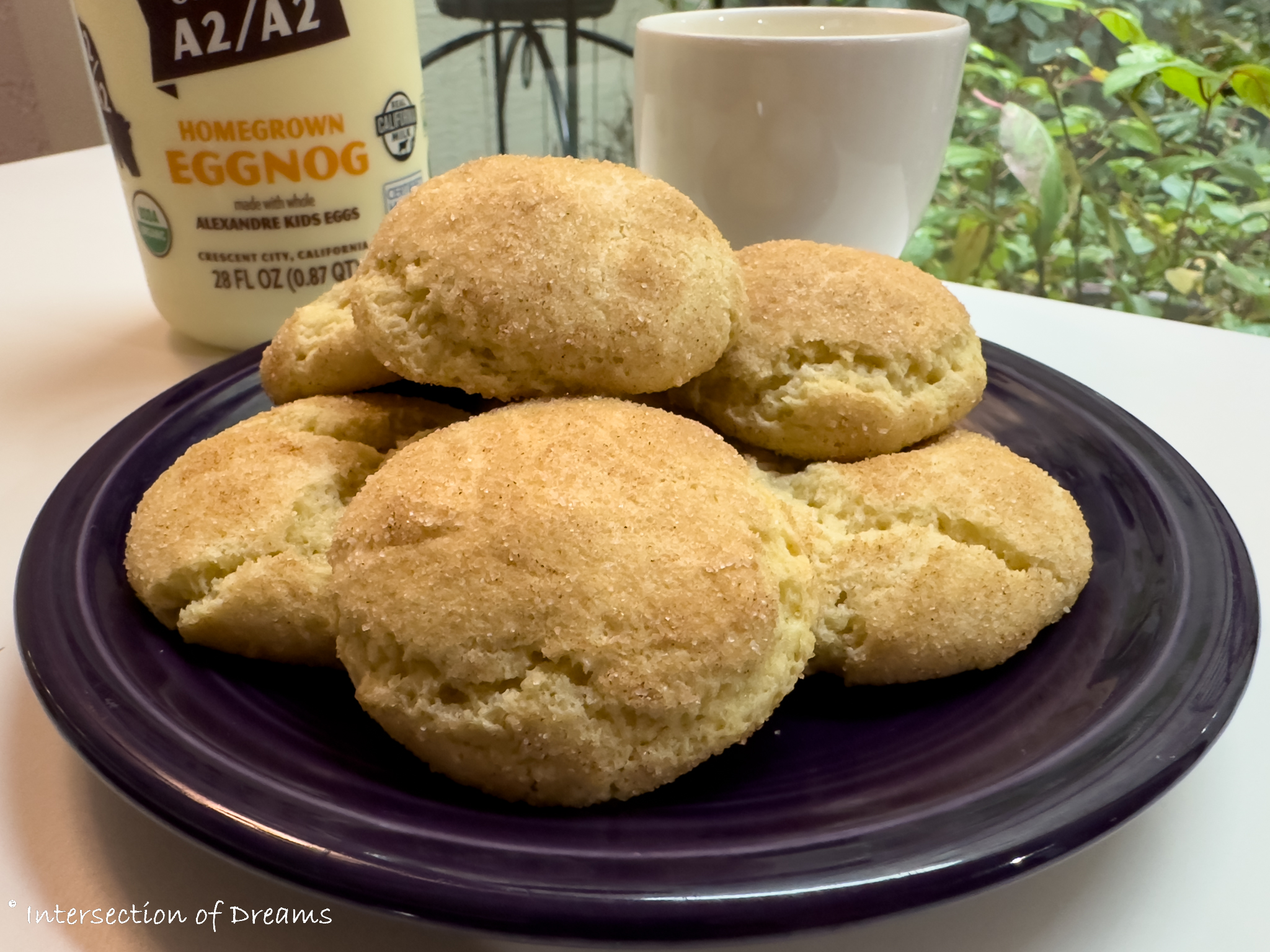 Eggnog Snickerdoodles stacked on a purple plate